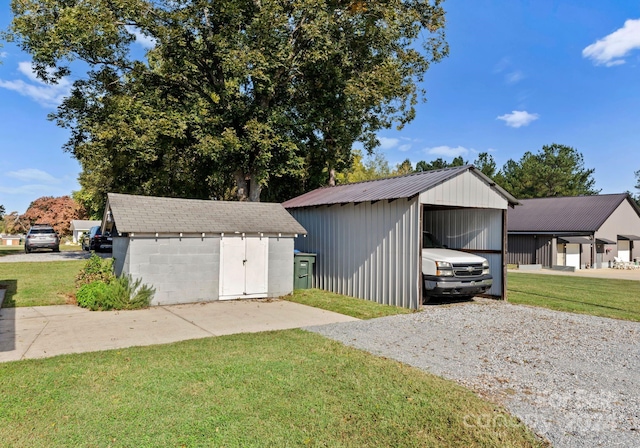 garage featuring a lawn