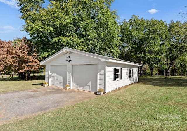 garage featuring a yard