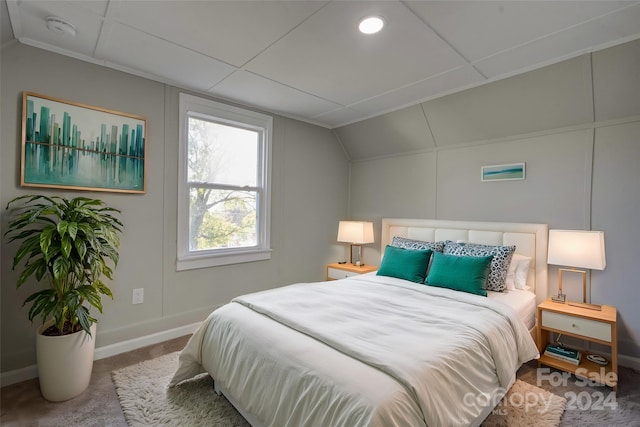 bedroom with carpet and lofted ceiling