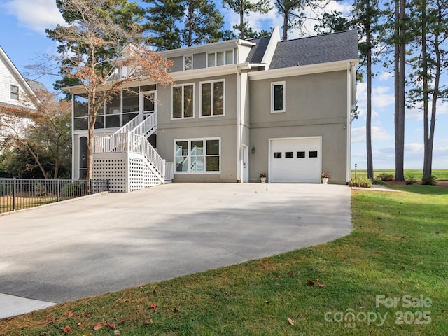 view of front facade with a front lawn and a garage