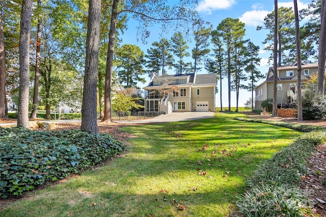 view of yard with a garage