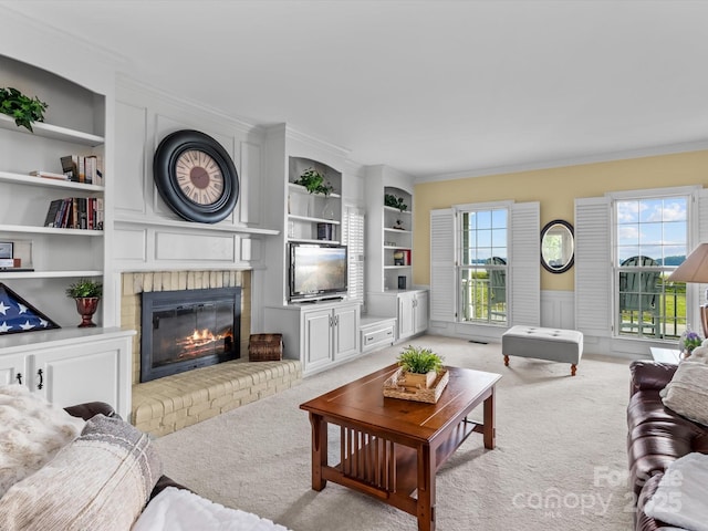 carpeted living room featuring built in shelves and a fireplace