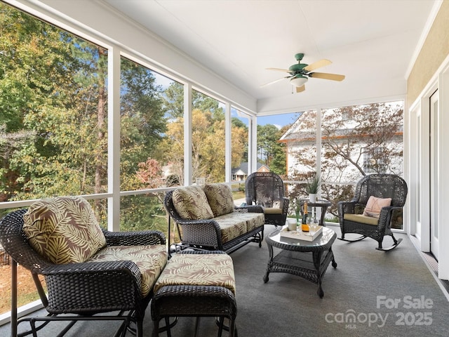 sunroom with ceiling fan