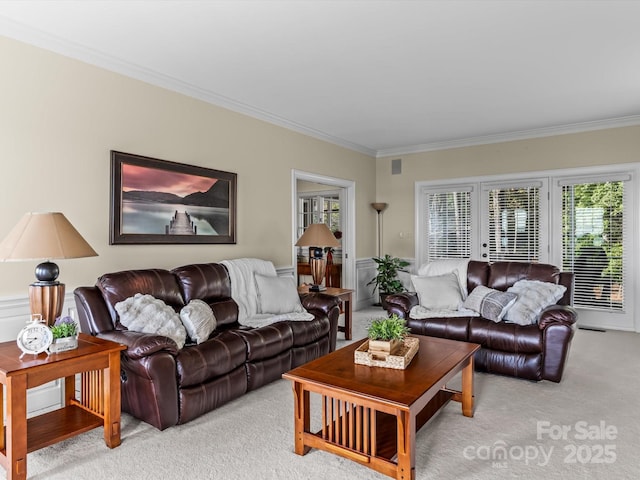 living room with light carpet and ornamental molding