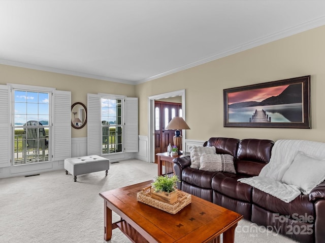 living room with carpet floors and ornamental molding