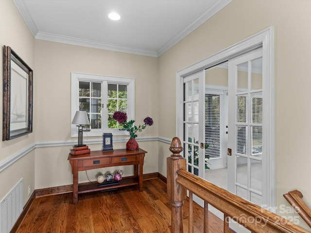 doorway to outside with dark hardwood / wood-style flooring, french doors, and ornamental molding