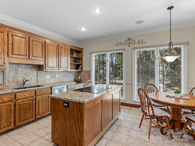 kitchen featuring dishwasher, sink, light tile patterned floors, decorative light fixtures, and a kitchen island