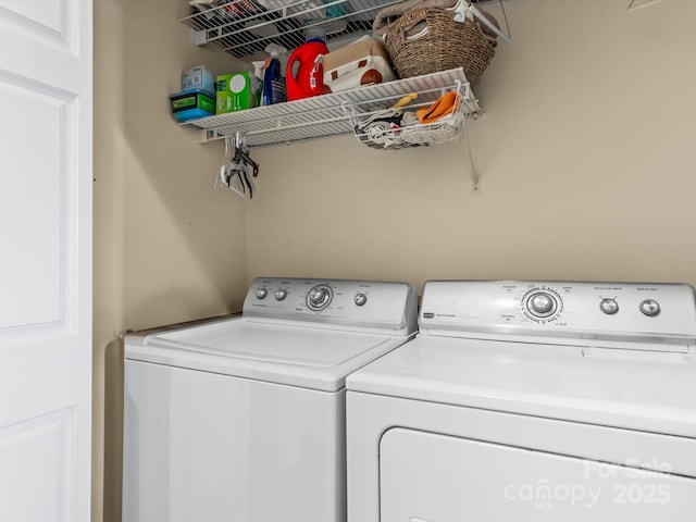 washroom featuring washer and dryer