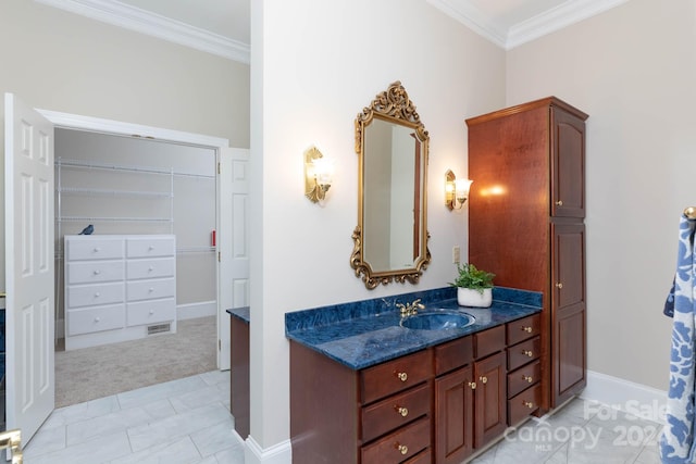 bathroom featuring vanity and ornamental molding