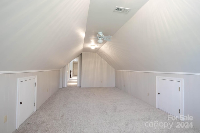 bonus room with light colored carpet, ceiling fan, and lofted ceiling