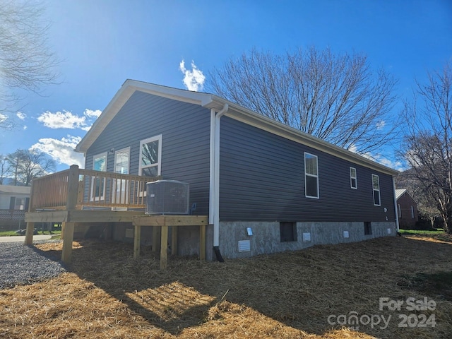 view of side of home featuring a deck