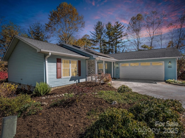 single story home with a garage