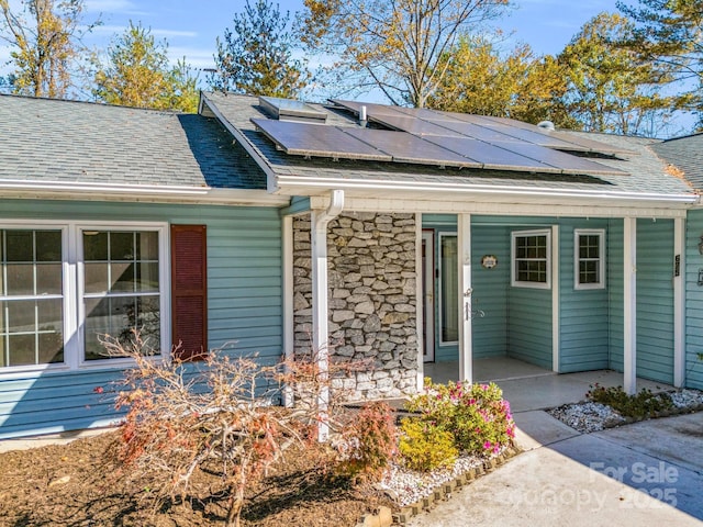 view of front of house with solar panels