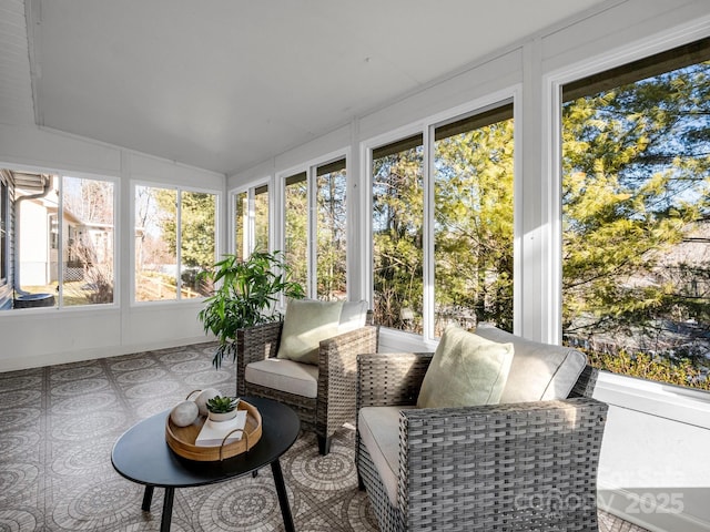 sunroom featuring vaulted ceiling