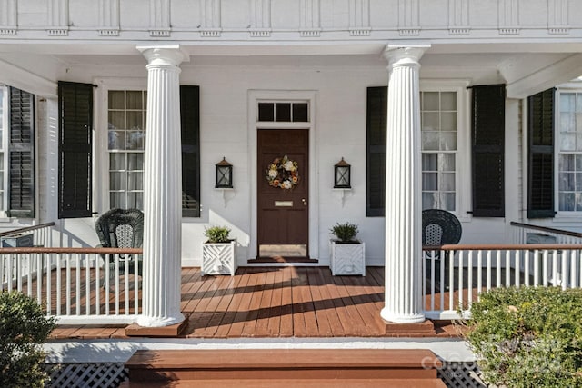 view of exterior entry with covered porch