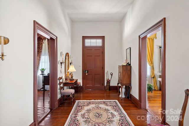 entrance foyer with dark hardwood / wood-style floors