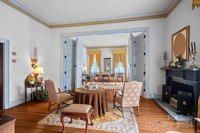 dining room featuring hardwood / wood-style flooring and ornamental molding