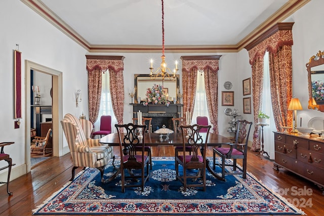 dining area with crown molding, dark hardwood / wood-style floors, and a notable chandelier