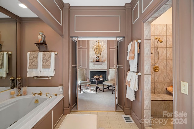 bathroom featuring a fireplace, ornamental molding, and a washtub