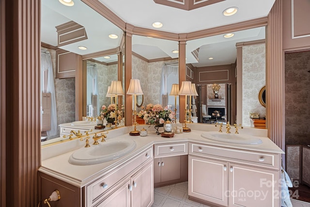 bathroom with crown molding and vanity