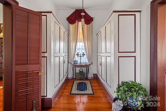 corridor with dark hardwood / wood-style floors