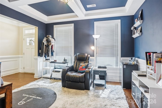 living area featuring crown molding and dark hardwood / wood-style floors