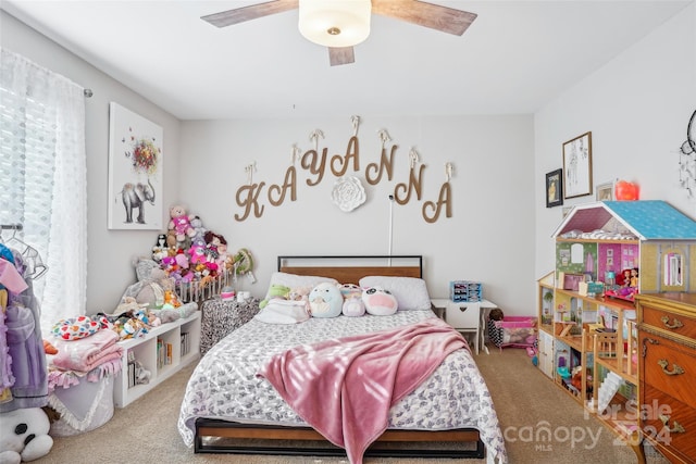 bedroom featuring ceiling fan and light carpet