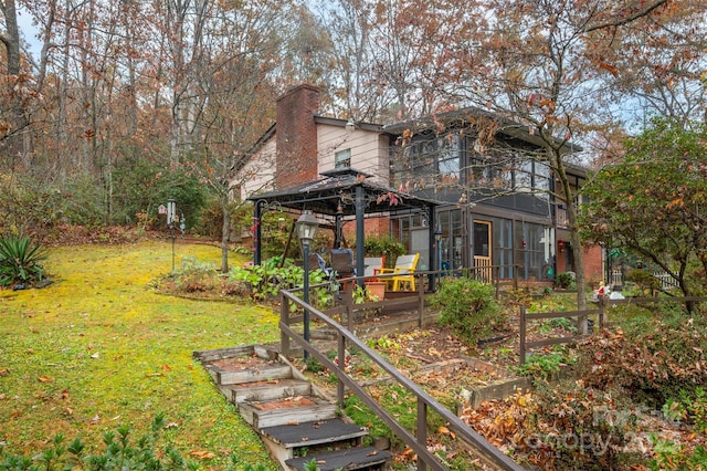 view of yard with a gazebo and a garden