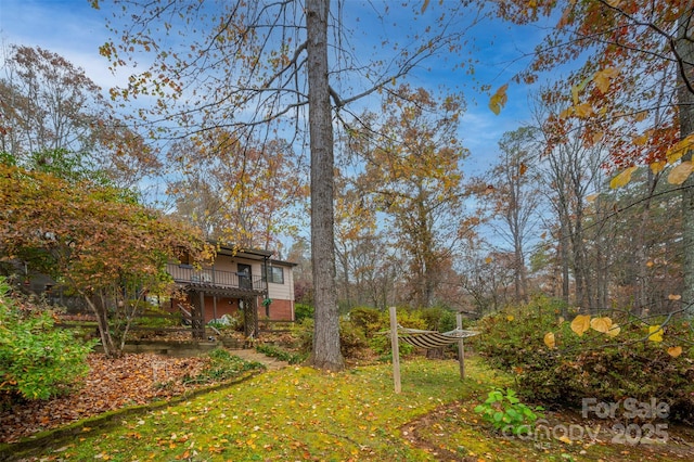 view of yard with a wooden deck