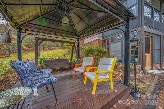 wooden deck featuring a gazebo