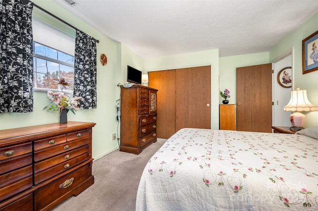 bedroom with carpet floors and a closet