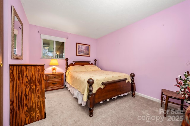 bedroom with carpet flooring and baseboards