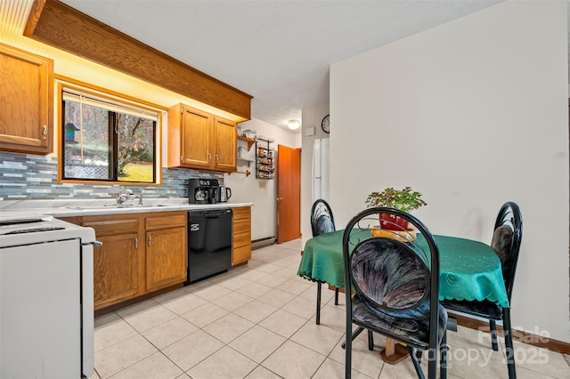 kitchen with light tile patterned floors, light countertops, backsplash, electric range, and dishwasher