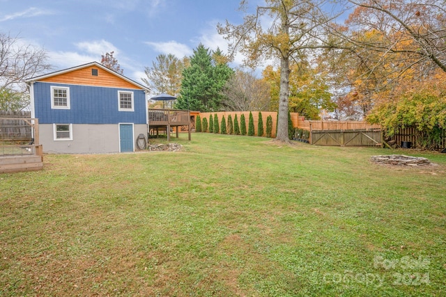 view of yard with a wooden deck