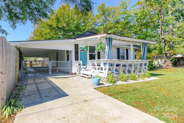 exterior space with a lawn and a carport