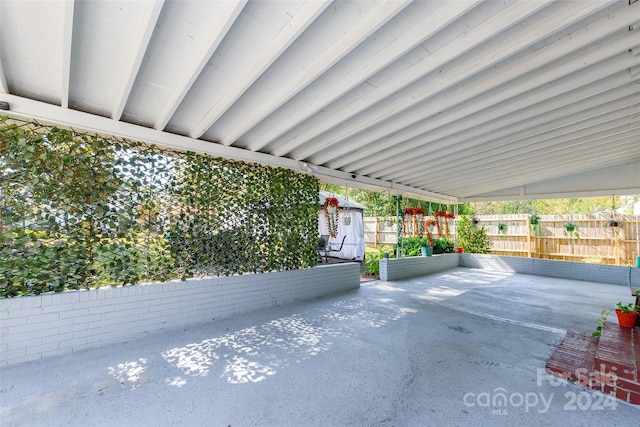 view of patio / terrace with a shed