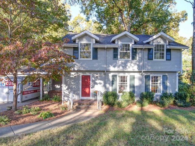 view of front of property with a front lawn