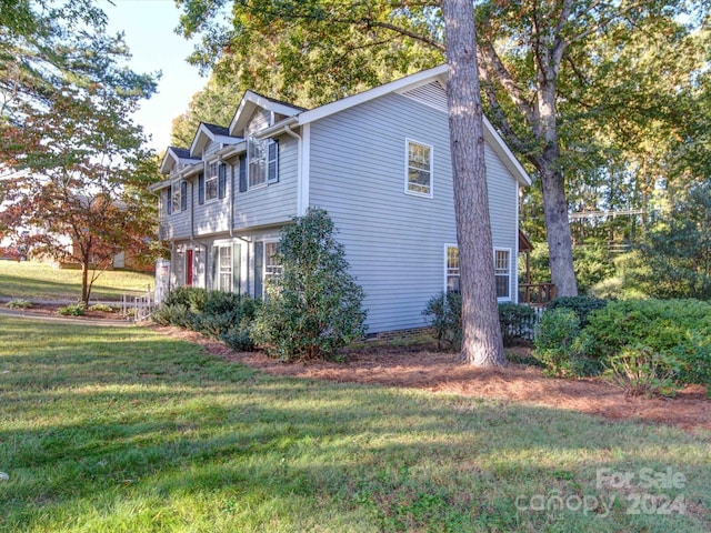 view of home's exterior featuring a yard