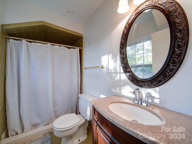 bathroom with walk in shower, vanity, and toilet