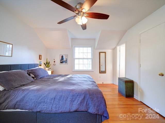 bedroom featuring vaulted ceiling, hardwood / wood-style flooring, and ceiling fan