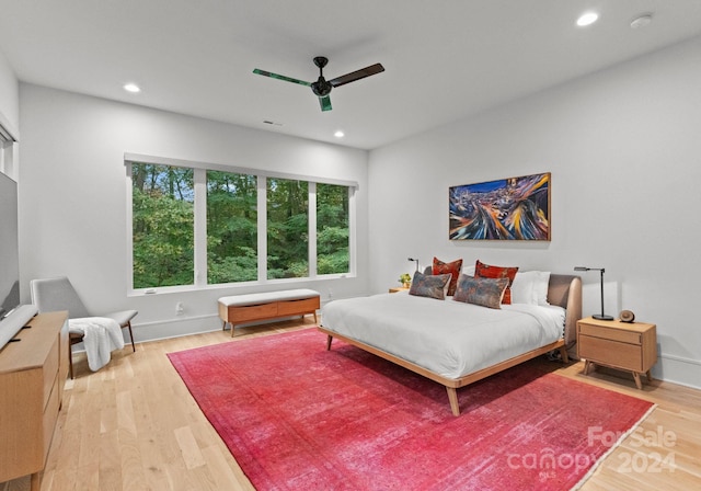 bedroom featuring hardwood / wood-style floors and ceiling fan