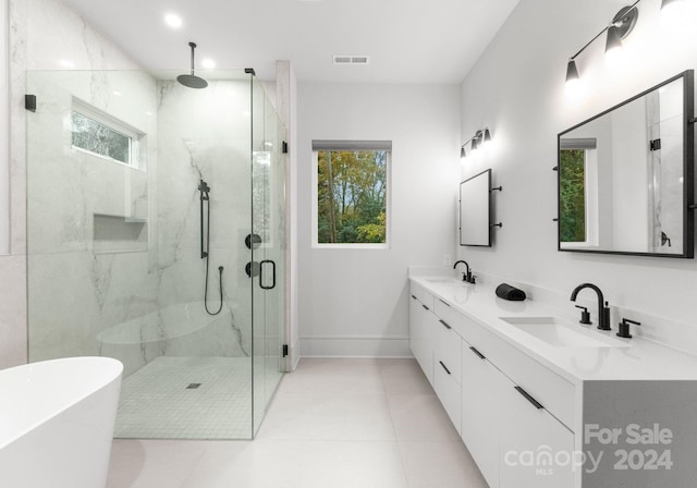 bathroom with vanity, shower with separate bathtub, plenty of natural light, and tile patterned flooring