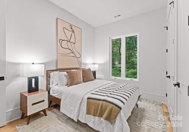 bedroom featuring light hardwood / wood-style floors