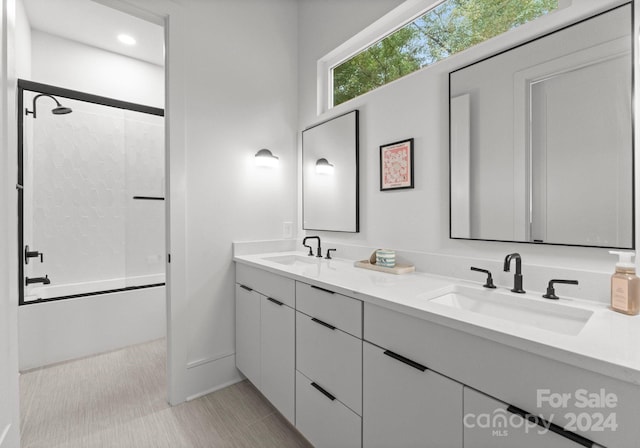 bathroom featuring vanity and shower / bathing tub combination