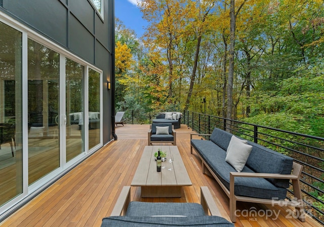 deck featuring outdoor lounge area