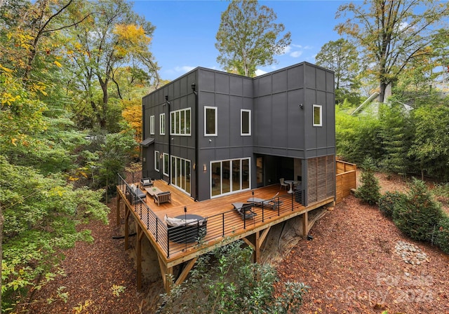 back of house featuring a wooden deck