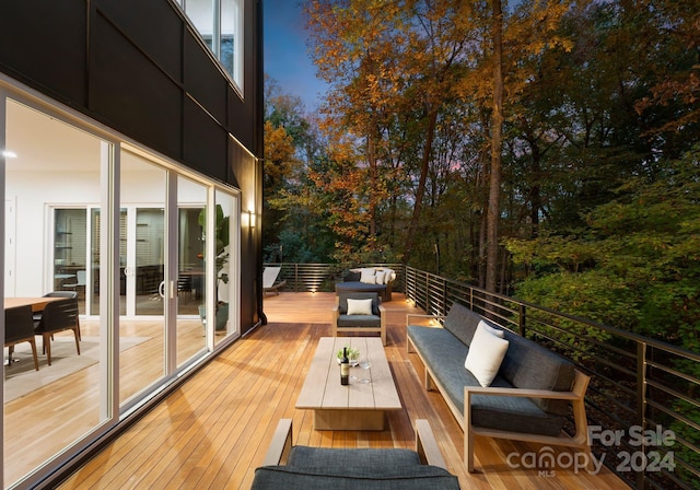 wooden terrace with outdoor lounge area