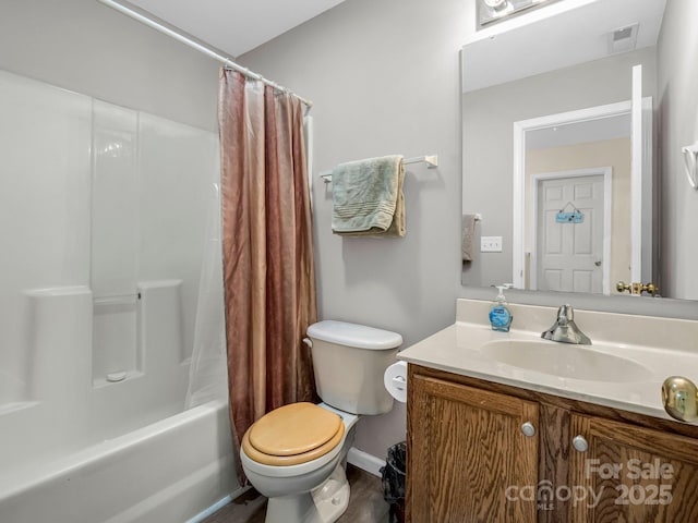 full bathroom with shower / bath combo, vanity, and toilet