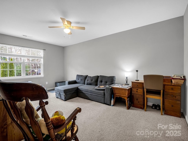 living room with ceiling fan and light colored carpet