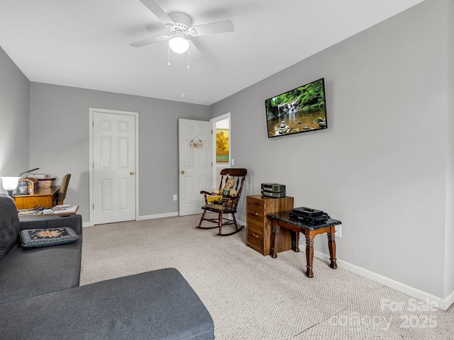 sitting room featuring carpet flooring and ceiling fan